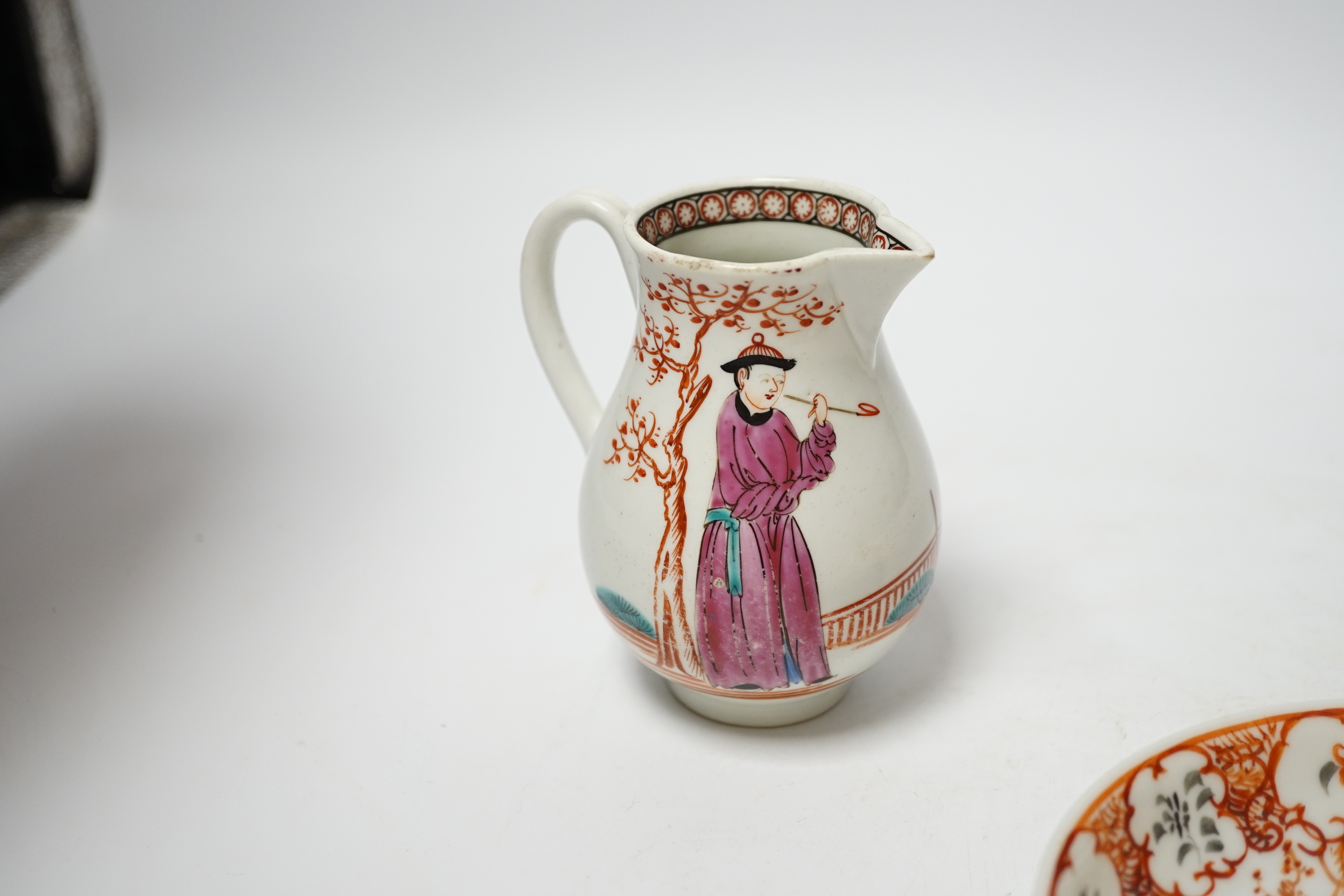 A Worcester sparrowbeak jug and a similar coffee cup together with an 18th century Chinese export saucer, 13cm diameter